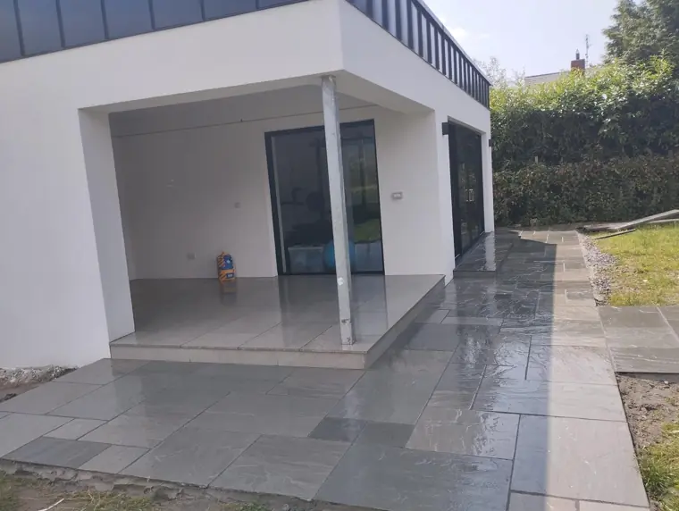 Sandstone paving around a new garden room