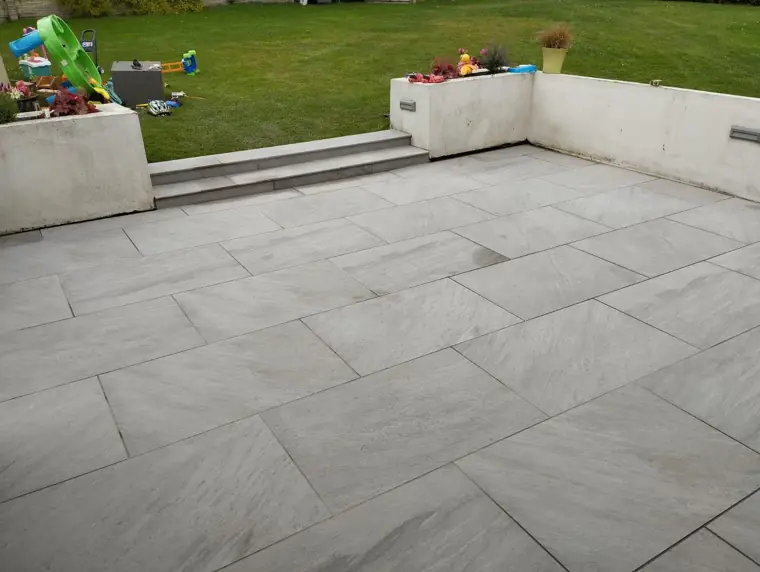 Light grey porcelain patio and lawn